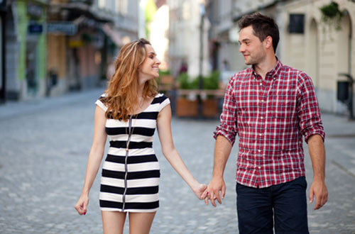 Young couple walking in the old part of town