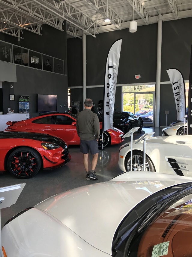 Mark checks out the cars displayed at August Luxury Motorcars