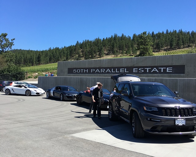 Wine purchases from 50th Parallel are carefully loaded into the Jeep 