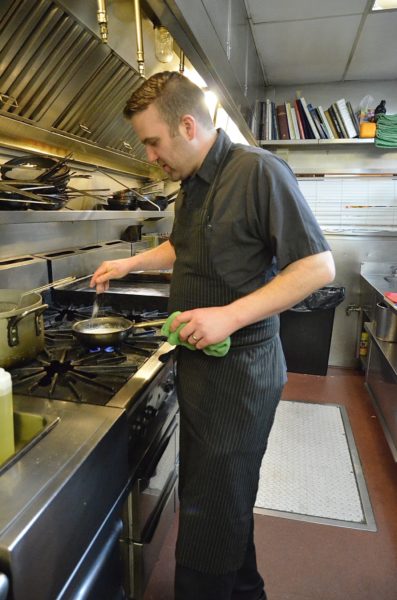 Chef Mike Mikoda of Bistro Pastis prepares Sole Normande, one of the featured dishes at the upcoming Good France event March 21 - photo by Cathy Browne