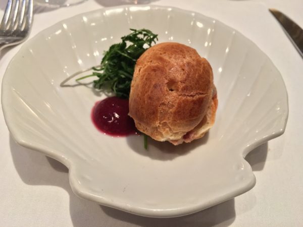 Our first perfect bite at Bistro Pastis - a Foie Gras Parfait Profiterole. Photo by Cathy Browne